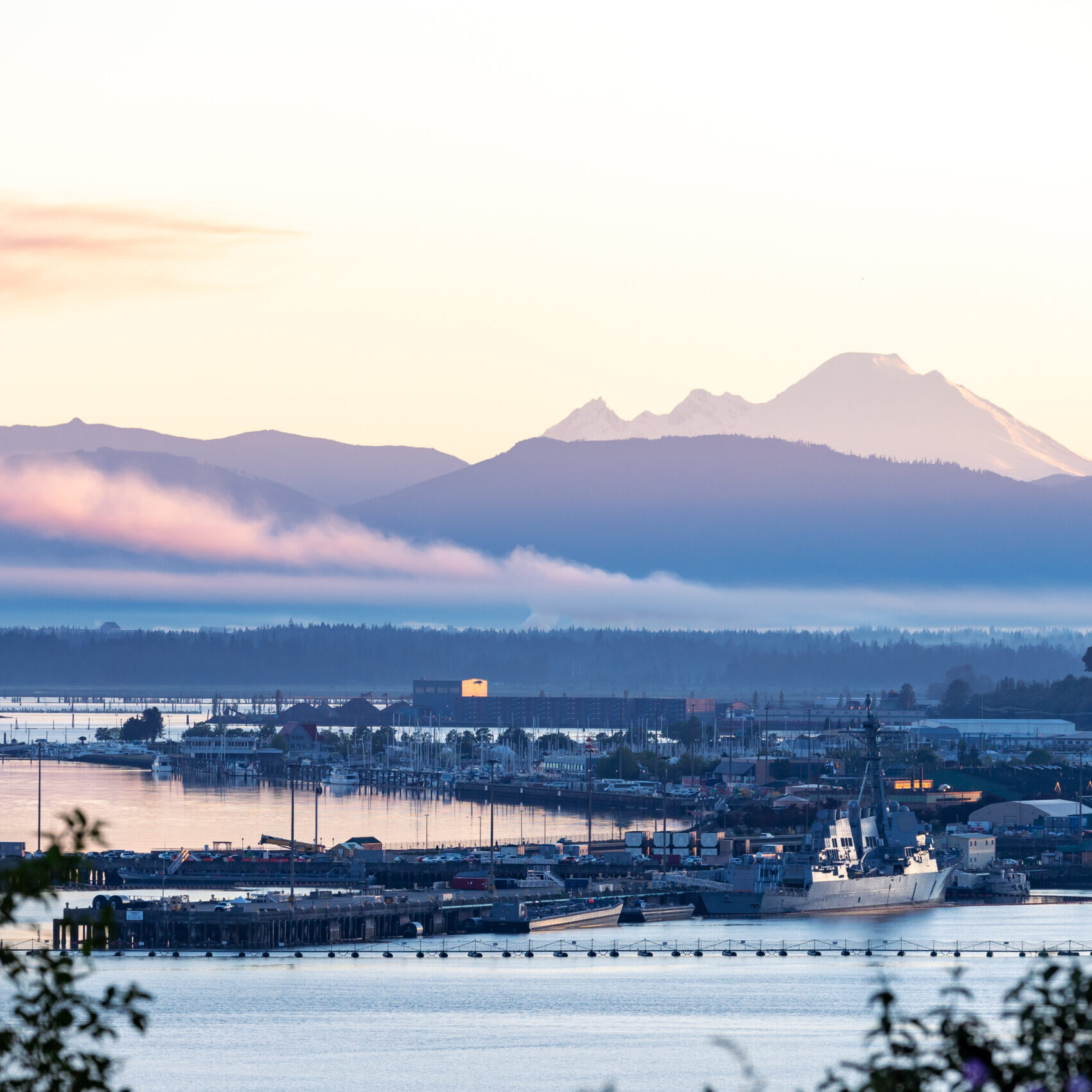 Everett, WA - USA: 06-07-2022:  Port of Everett Waterfront at Sunrise. Mount Baker in Background