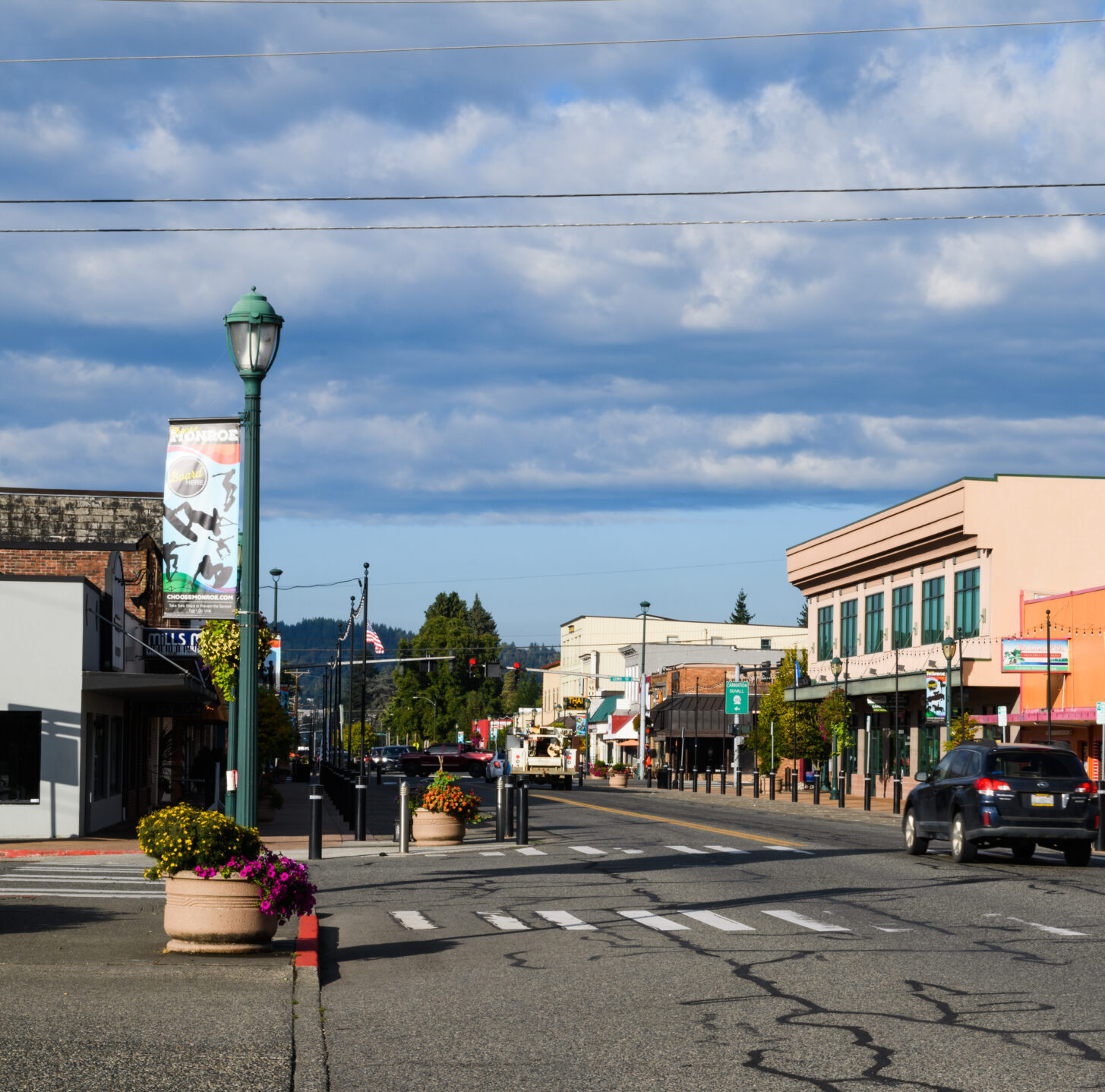 Monroe, WA, USA - September 08, 2021; Main Street in Monroe Washington on a late summer morning under partly cludy skies