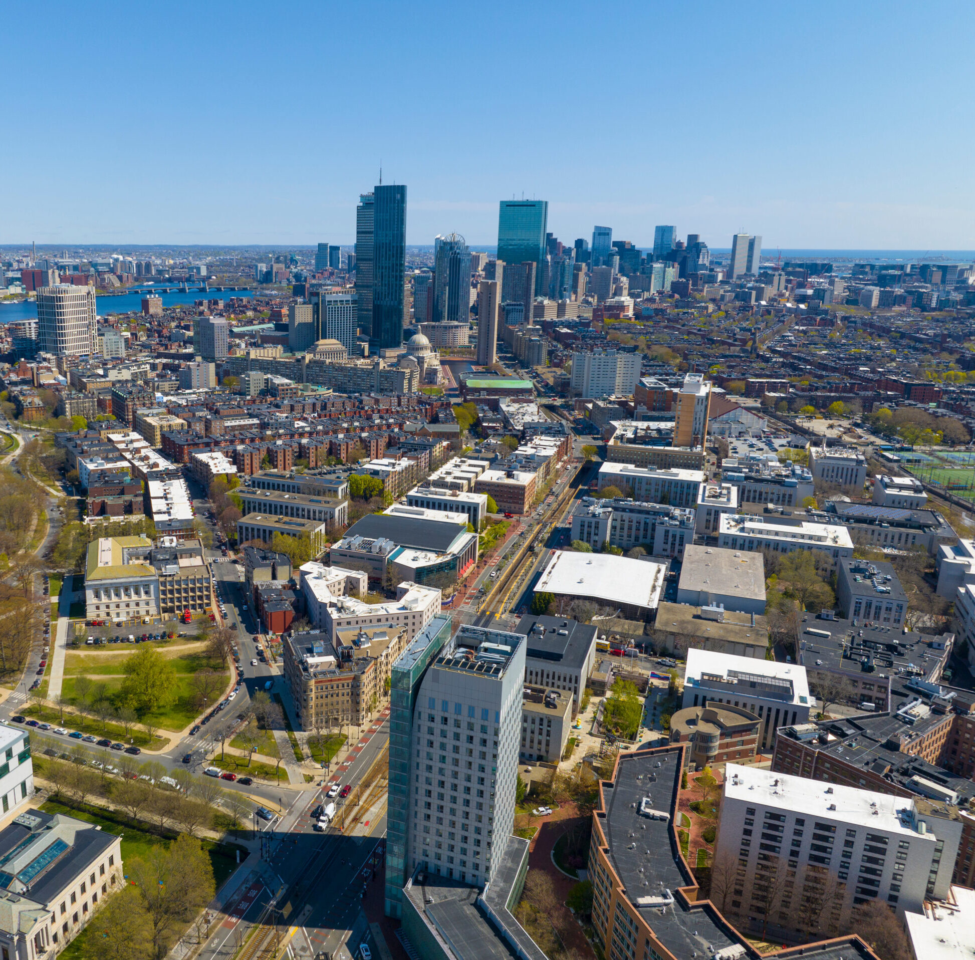 Boston Back Bay modern city skyline including John Hancock Tower, Prudential Tower, and Four Season Hotel at One Dalton Street from Fenway on Huntington Avenue in Boston, Massachusetts MA, USA.
