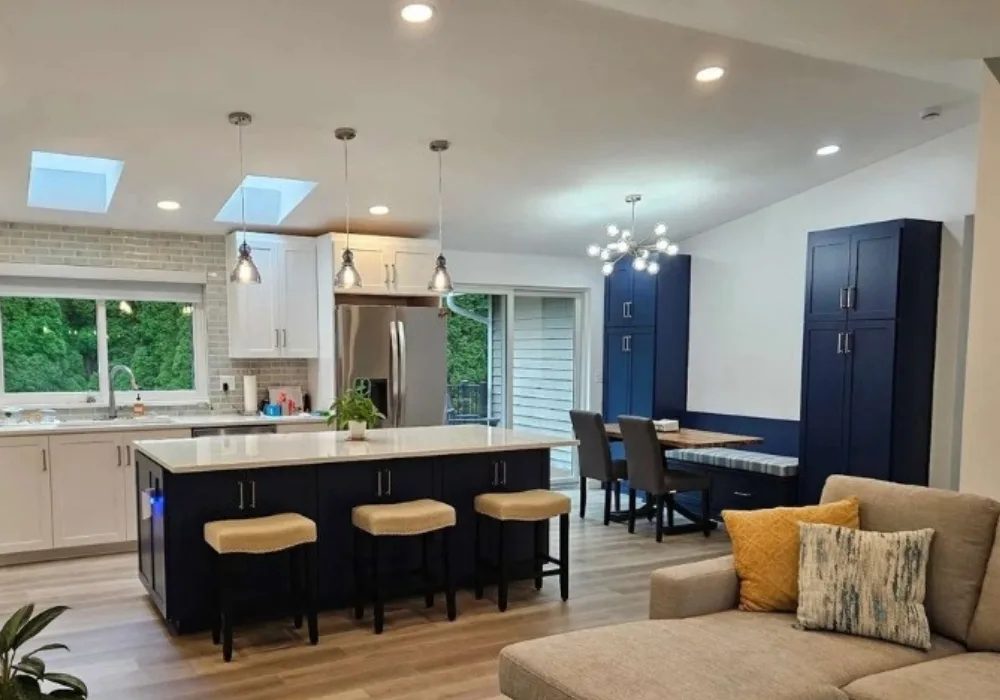 lighting specialists in Everett electrician installing recessed lighting fixture in ceiling