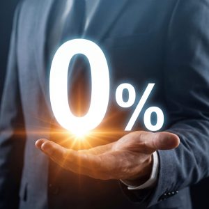 Zero Interest Rate Offer and No Commission Concept with Businessman Holding Glowing 0% Symbol