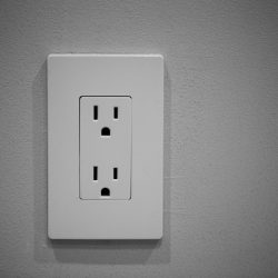 double American socket wall plug on wall